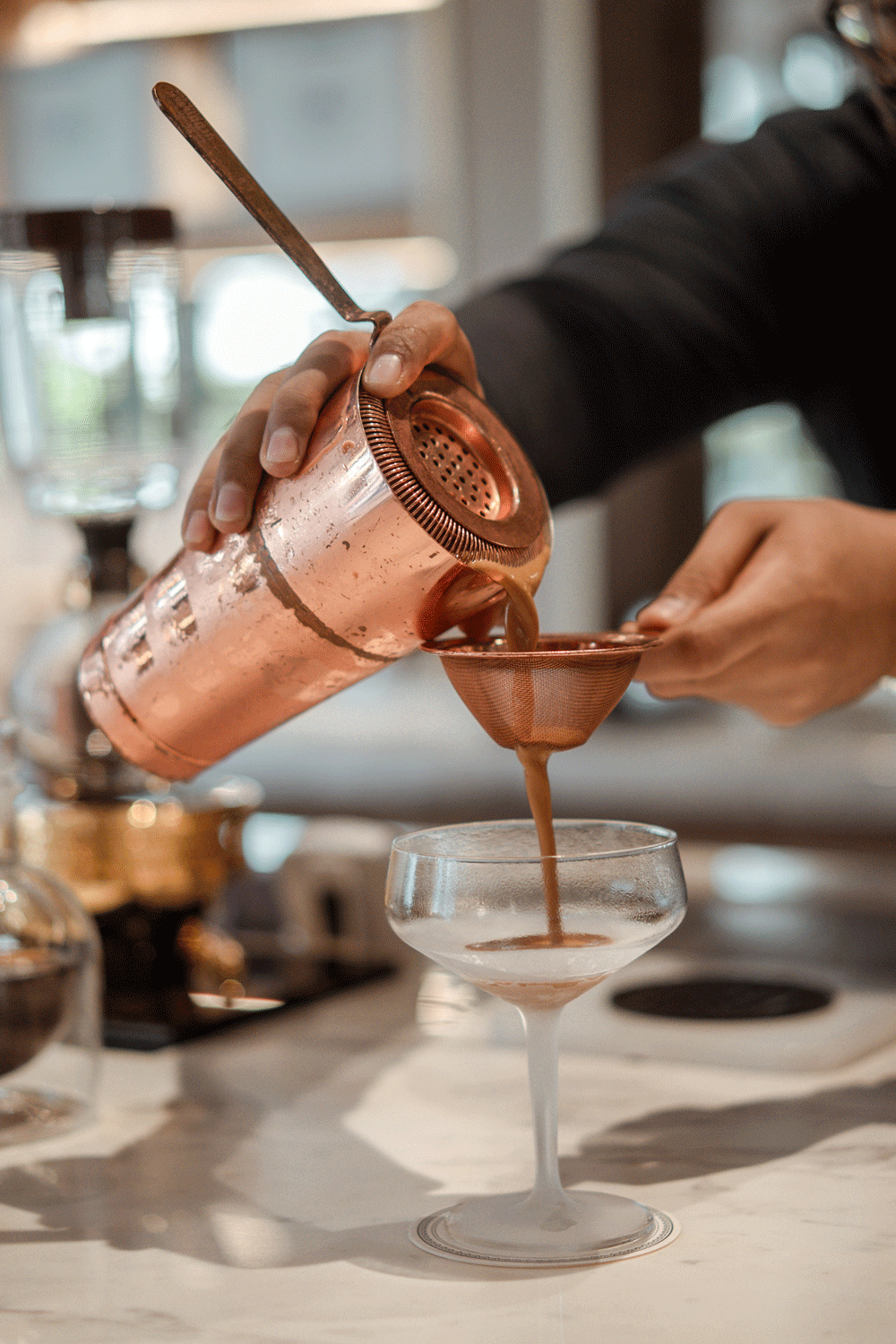 coffee being poured at Singapore Coffee in Raffles Hotel, Photography by Melissa C Koh | melissackoh.com