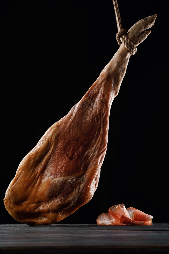 Ham, leg, Parma ham. Thin slicing. On black background. Spain.